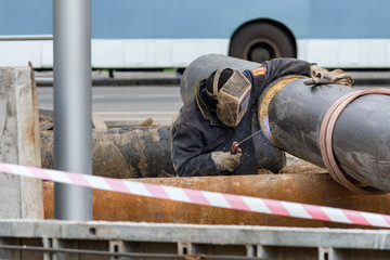 Worker welding gas line