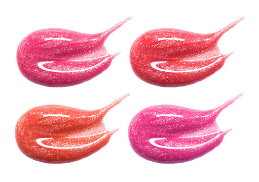 Set of different lip glosses pastel color smear samples isolated on white. Smudged makeup product sample.