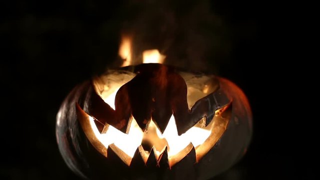 Burning pumpkin on Halloween. Looped