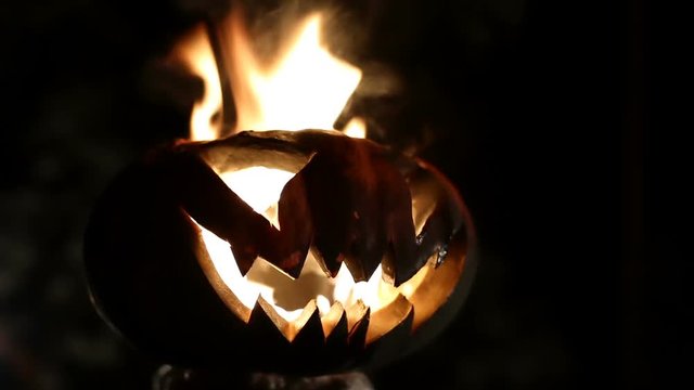Burning pumpkin on Halloween. Looped