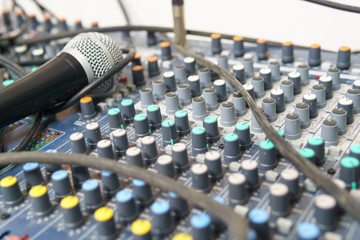 close up of button of sound mixed with blurred microphone.