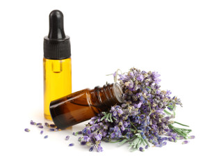 Bottle with aroma oil and lavender flowers isolated on white background