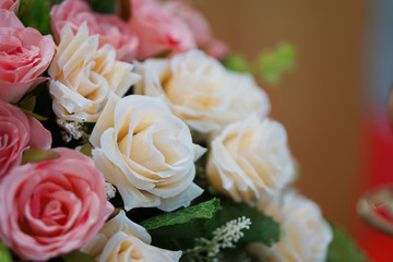 Obraz premium Closeup beautiful roses of beige fabric. Artificial flower made from fabric.