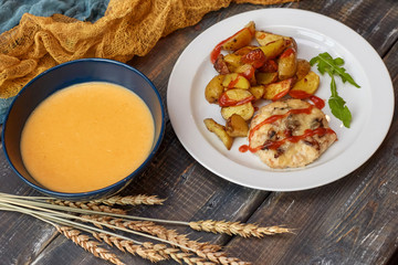 Fried potato with meat and pumpkin soup