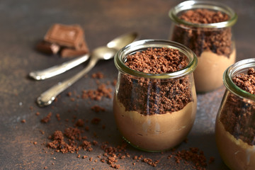 Chocolate cheesecake in a vintage glass jar.