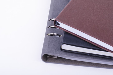 Stacking diaries on white background. negative space for text