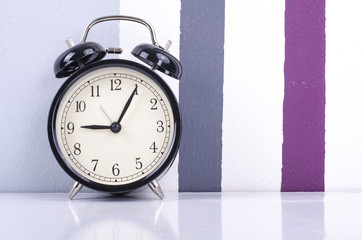 closeup  vintage alarm clock for time management concept