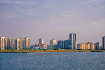Fototapeta premium Urban landscape of commuter town on river bank in Kazan, Russia