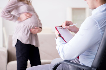 Pregnant woman visiting psychologist doctor