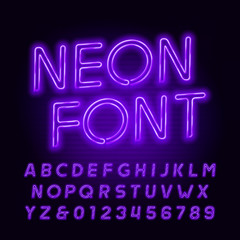 Purple neon tube alphabet font. Neon color oblique letters and numbers. Stock vector typeface for your headers or any typography design.