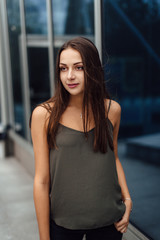 Business woman stand near building