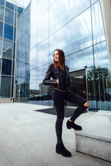 Business woman stand near building