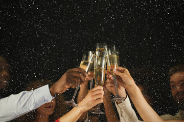 Group of young people celebrating new year with champagne at night club - obrazy, fototapety, plakaty