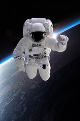 Fototapeta na wymiar Astronaut at spacewalk