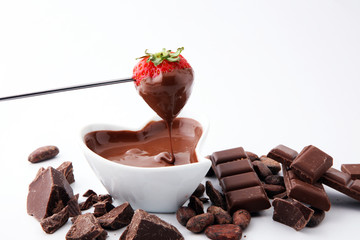 Fondue with Melting chocolate or melted chocolate and strawberry.