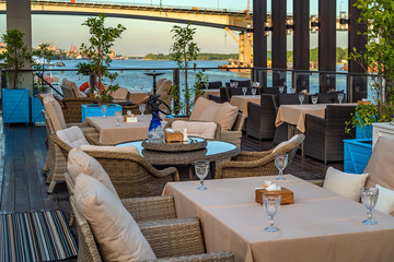 Interior of restaurant on water, sofa and table