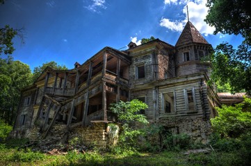 Fototapeta na wymiar Creepy haunted rotten abandoned wooden palace. Former mansion of earl Naryshkin in Bikovo, Ryazan region