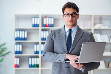 Businessman in the office working with laptop