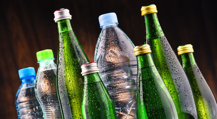 Different sorts of bottles containing mineral water © monticellllo