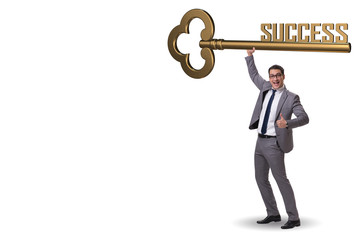 Businessman with key to success business concept
