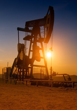 oil pump on sunset