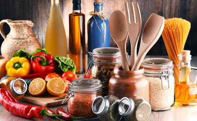 Composition with assorted food products and kitchen utensils