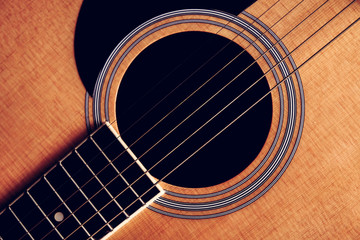 Close Up shot photo of Classic acoustic guitar with filter effect retro vintage style