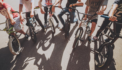 Company of young men on BMX at the skatepark