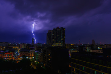 beautiful panorama landscape of pattaya cityscape at night and hit by lightning or thunderclap. cityscape at night with dark purple sky and cloud when lightning