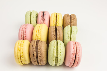 french sweet macarons  in pink, yellow, green and brown