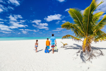 Father with kids at beach