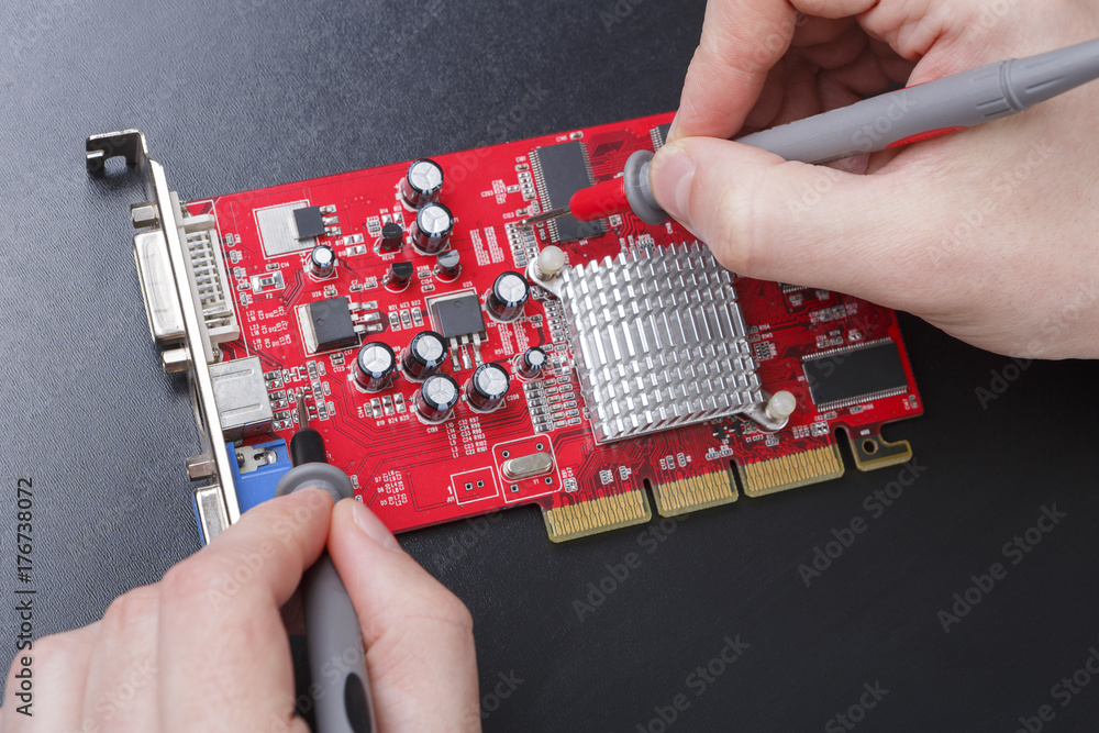 Poster electronic circuit red board inspecting close up