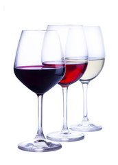 Row of three wine glasses with red, white and rose wine isolated on white background