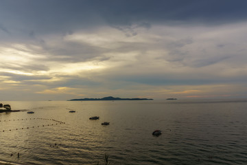 beautiful panorama landscape of sea at dusk in evening when sunset with multicolor light with mountain, blue sky and cloud  background. sky and sea twilight.