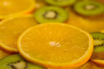 Background of the kiwi and orange fruits. Selective focus