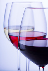 Set of three wine glasses with red, white and rose wine close up