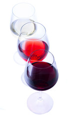 Set of three wine glasses with red, white and rose wine isolated on white background