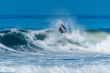 Bodyboarder surfing ocean wave