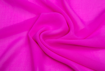 background image of a pink light fabric folded, artificial silk