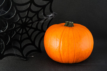 Halloween - pumpkin, spiders, cobweb,
cap babe jag (witches)
on black background. Place for the inscription 