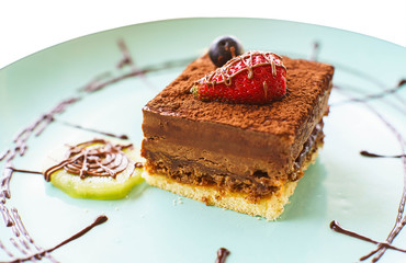 Cake chocolate strawberry in the plate isolated for white background.
