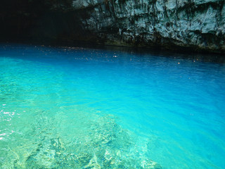 The turquoise water of the underground Melissani lake in Cephalonia or Kefalonia in Greece.