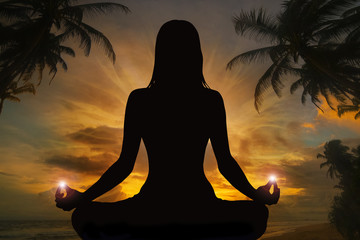 Silhouette of woman doing yoga