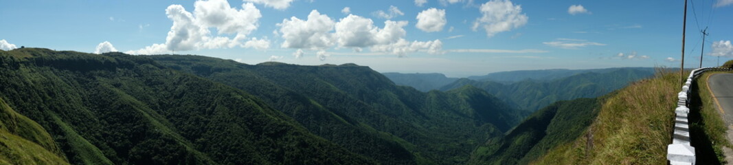 Panoramic view of mountain valleys and road