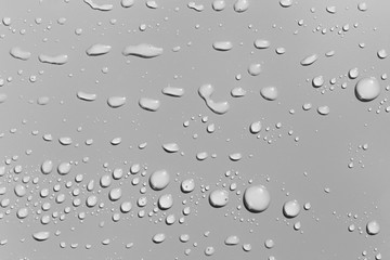 Water drops on a  grey surface, background