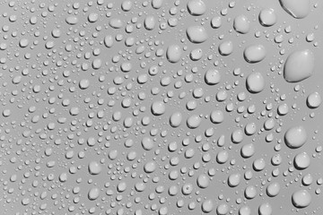 Water drops on a  grey surface, background