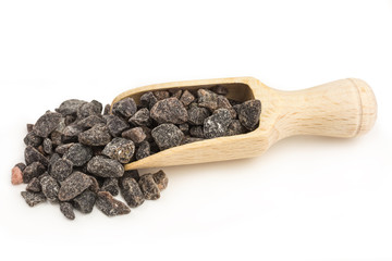 black himalaya salt from Pakistan, tasting of sulphur because of the vulcanic rock on a wooden scoop