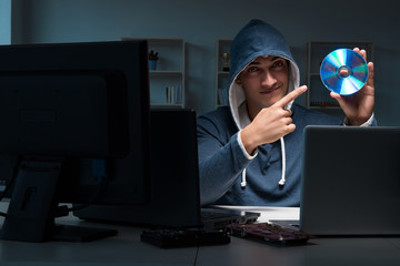 Hacker hacking computer at night