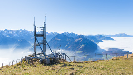 Instruments for measuring and transmitting a signal. Antenna. Antenna for weather, radio, smartphone on top of the mountain.  Antenna.  Stoss, switzerland.