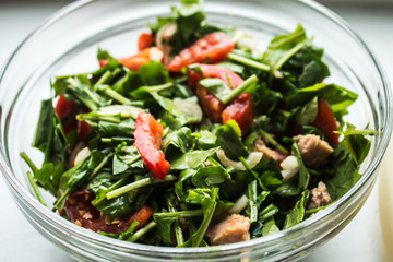fresh salad with arugula and tomato